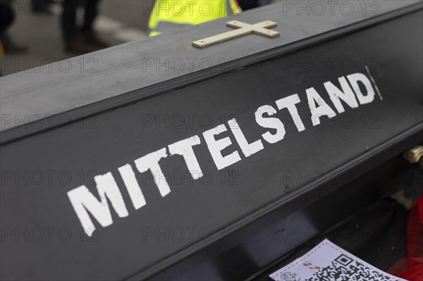 A coffin with the inscription 'AeoeMittelstand'Aeo taken as part of the 'AeoeBauern-Proteste'Aeo in Berlin, 22/03/2024