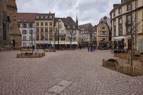 Place de la Cathedrale with cobblestones, historic houses and half-timbered buildings in Colmar, Department Haut-Rhin, Grand Est, France, Europe
