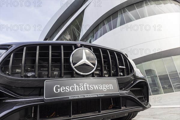 Mercedes company car, radiator grille and Mercedes star on a modern vehicle, in the background the Mercedes-Benz Museum, Baden-Wuerttemberg, Germany, Europe