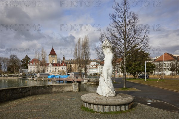 Statue of the Virgin of Lake Geneva, Vierge du Lac with the lakeside promenade and view of the harbour and Ouchy Castle in the Ouchy district, Lausanne, district of Lausanne, Vaud, Switzerland, Europe