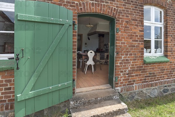 View from the garden into the kitchen of the historic farmhouse from the 19th century, Open-Air Museum of Folklore Schwerin-Muess, Mecklenburg-Vorpommerm, Germany, Europe