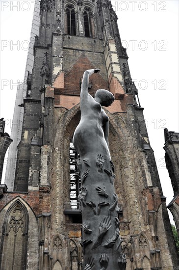St Peter's Church, parish church, construction started in 1310, Moenckebergstrasse, statue of a human being in front of a Gothic church tower, Hamburg, Hanseatic City of Hamburg, Germany, Europe
