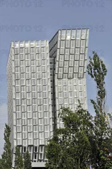 TANZENDE TUeRME, hotel and office building, completed in 2012, angled building with modern glass architecture surrounded by nature and sky, Hamburg, Hanseatic City of Hamburg, Germany, Europe