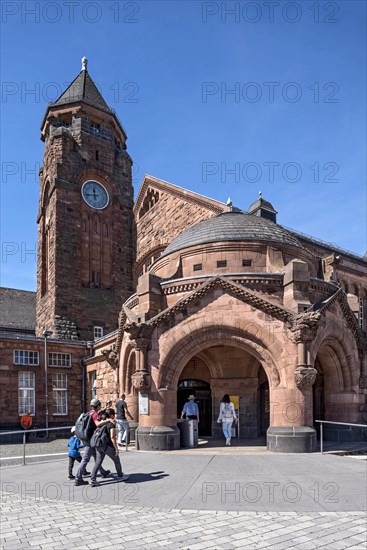 Historic Wilhelmine railway station, clock tower, pavilion with entrance to the station building, neo-Romanesque and Art Nouveau, red sandstone, cultural monument, listed building, Giessen, Giessen, Hesse, Germany, Europe