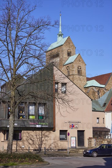 Commercial building and tower of Minden Cathedral, Muehlenkreis Minden-Luebbecke, North Rhine-Westphalia, Germany, Europe