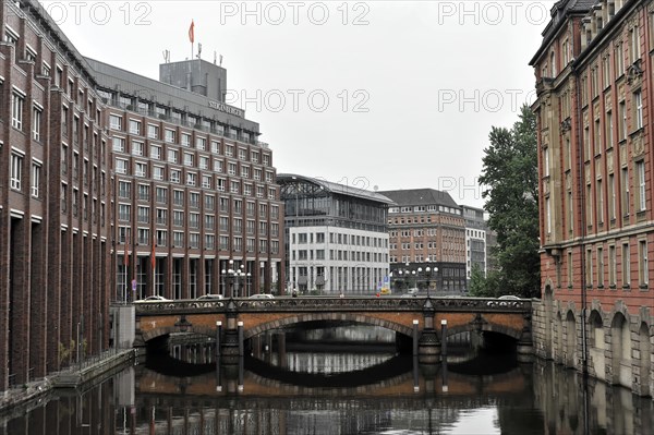 View of a bridge over a canal with reflections in Hamburg, Hamburg, Hanseatic City of Hamburg, Germany, Europe