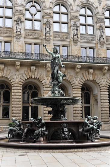 Historic fountain with sculpture in front of a detailed decorated building, Hamburg, Hanseatic City of Hamburg, Germany, Europe
