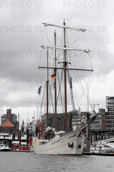 MARE FRISIUM, A large sailing ship in the harbour under a cloudy sky against a backdrop of buildings, Hamburg, Hanseatic City of Hamburg, Germany, Europe