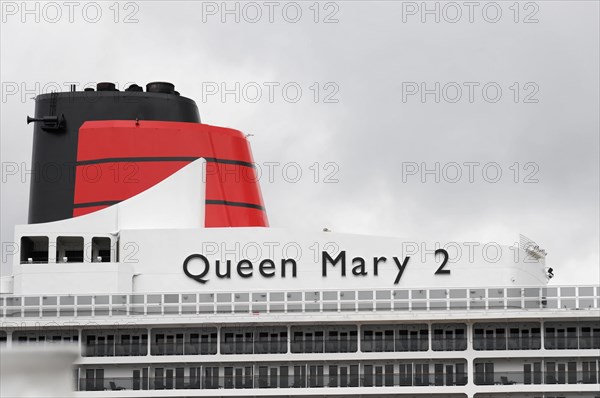 View of the funnel of the Queen Mary 2 cruise ship against a cloudy sky, Hamburg, Hanseatic City of Hamburg, Germany, Europe