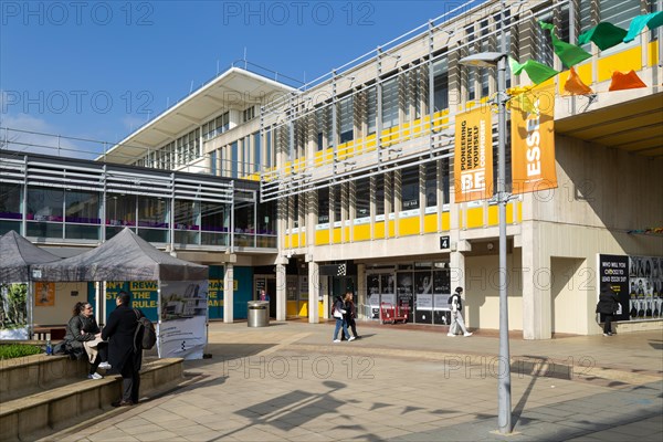 Students in one of the campus squares, University of Essex, Colchester, Essex, England, UK