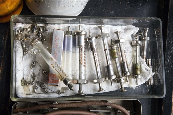 Old syringes in a bowl stand in the former laboratory of the historic Berg-Apotheke pharmacy in Clausthal-Zellerfeld, which was built in 1674 and is one of the oldest pharmacies in Germany, 09 November 2015