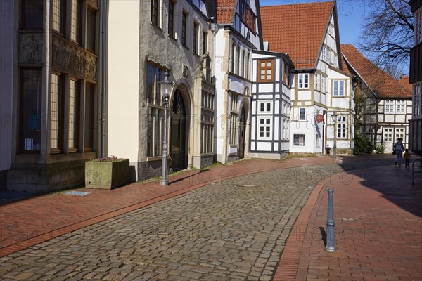 Historic facades and half-timbered houses, lantern and cobblestone street in the Schnurrviertel in the old town centre of Minden, Muehlenkreis Minden-Luebbecke, North Rhine-Westphalia, Germany, Europe