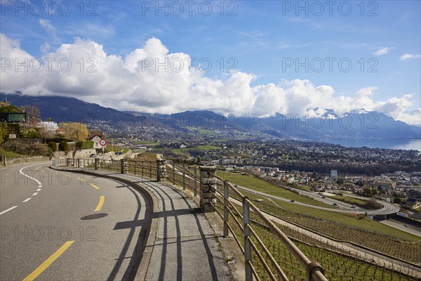 Main road 12 leads through the UNESCO World Heritage vineyard terraces of Lavaux with views of Vevey and Lake Geneva from the Jongny site, Riviera-Pays-d'Enhaut district, Vaud, Switzerland, Europe