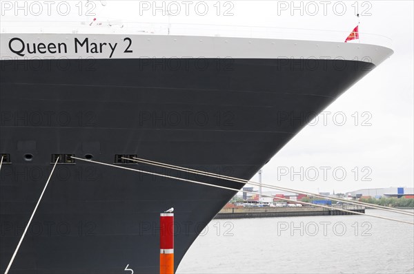 Close-up of the bow of a large dark cruise ship Queen Mary 2, on the water, Hamburg, Hanseatic City of Hamburg, Germany, Europe