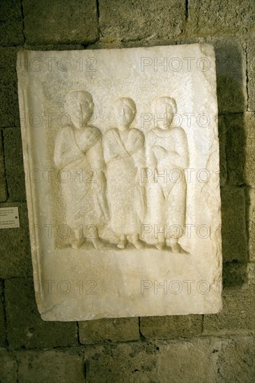 Grave stele two males and a female figures from Nisyros Archaeological museum, Rhodes, Greece, Europe