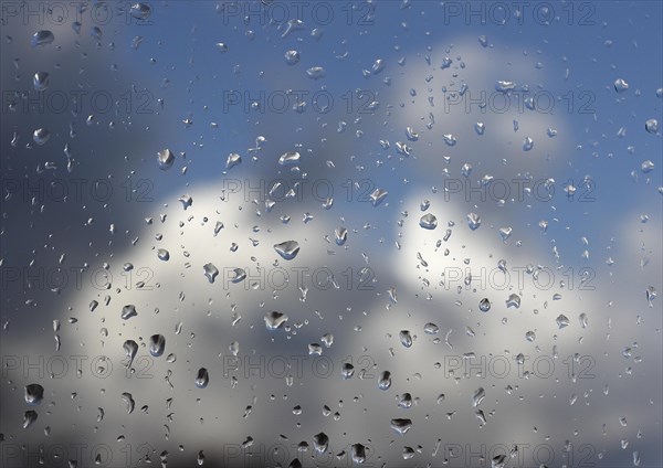 Raindrops on a window pane, North Rhine-Westphalia, Germany, Europe