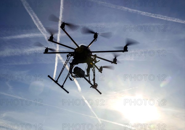 An octocopter drone filming with a video camera, 10.12.2015