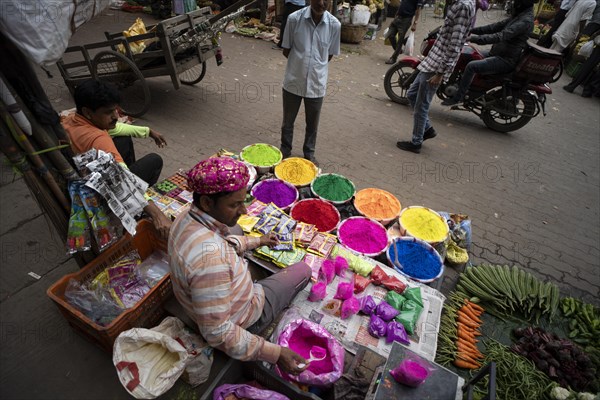 Vendor sells Holi celebration items in a street market, ahead of Holi festival on March 23, 2024 in Guwahati, Assam, India. Holi is the Hindu festival of colours, it is celebrated with great joy in India