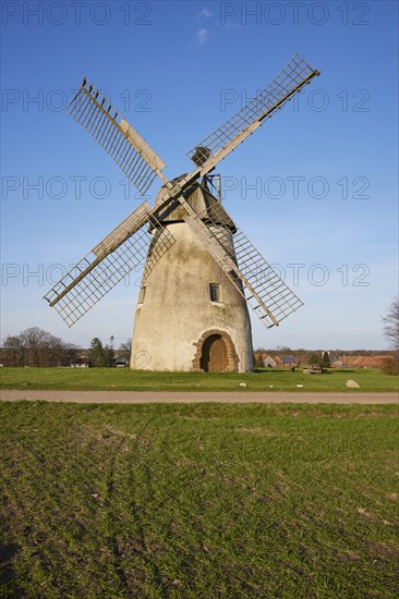 Windmill Auf der Hoechte under a cloudless blue sky is part of the Westphalian Mill Road in Hille, Muehlenkreis Minden-Luebbecke, North Rhine-Westphalia, Germany, Europe
