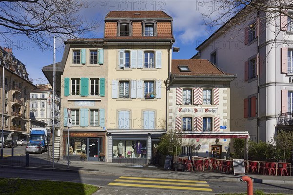 Historic, pastel-coloured houses with white windows and wooden shutters and the Cafe Vieil Ouchy in the Ouchy district, Lausanne, district of Lausanne, Vaud, Switzerland, Europe