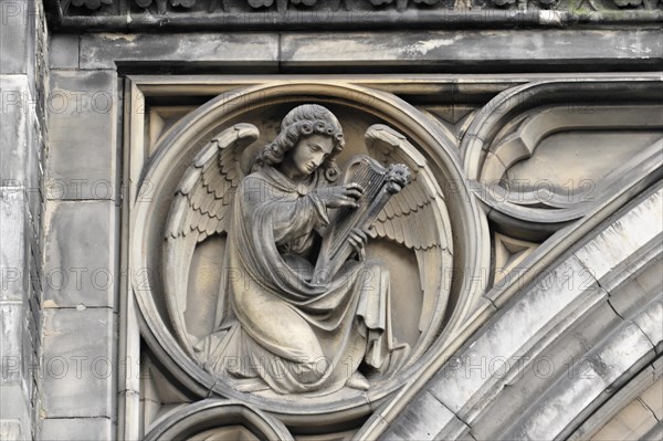 St Peter's Church, parish church, start of construction 1310, Moenckebergstrasse, angel figure playing a harp, engraved in stone in Gothic style, Hamburg, Hanseatic City of Hamburg, Germany, Europe