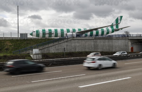 An Airbus A330 Neo from Condor crosses a bridge next to the A3 motorway at Frankfurt Airport, 16.03.2024