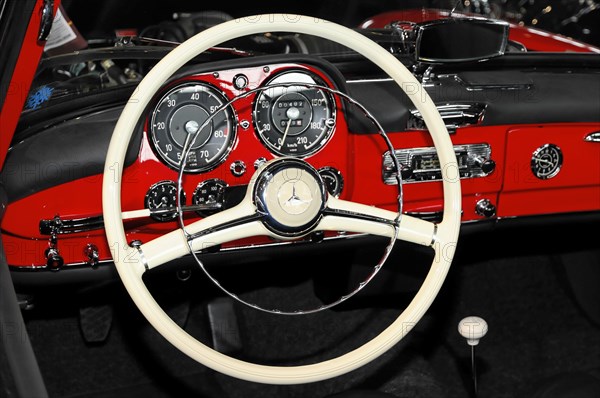 RETRO CLASSICS 2010, Stuttgart Messe, View of the white steering wheel and dashboard of a classic red Mercedes-Benz vintage car, Stuttgart Messe, Stuttgart, Baden-Wuerttemberg, Germany, Europe