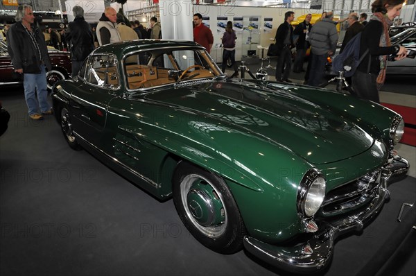 RETRO CLASSICS 2010, Stuttgart Messe, Side view of a green Jaguar E-Type classic car at a trade fair, Stuttgart Messe, Stuttgart, Baden-Wuerttemberg, Germany, Europe