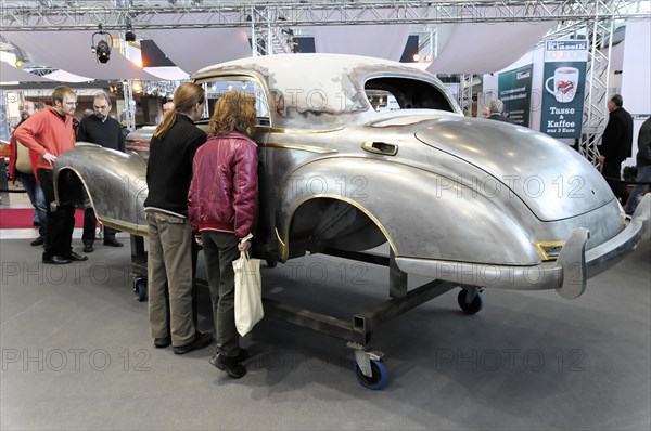 RETRO CLASSICS 2010, Stuttgart Messe, People look at the unfinished restoration of the bodywork of a classic car, Stuttgart Messe, Stuttgart, Baden-Wuerttemberg, Germany, Europe