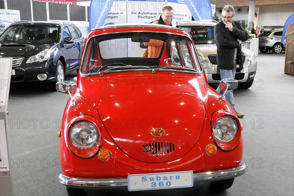 A red Subaru 360 classic car, Subaru 360, presented at a car show, Stuttgart Messe, Stuttgart, Baden-Wuerttemberg, Germany, Europe