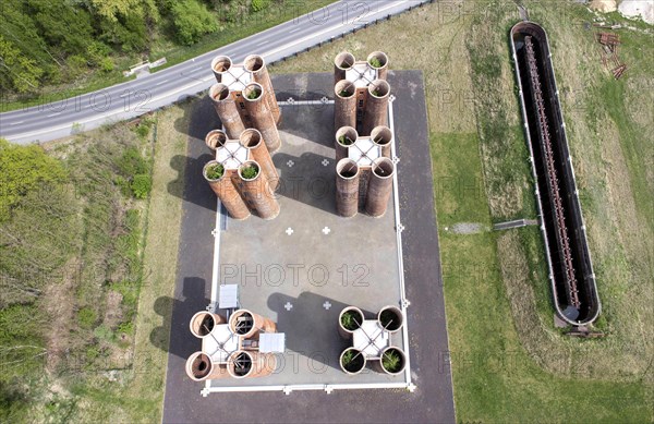 An aerial photo shows 24 brick towers rising 22 metres into the sky above Lauchhammer. They are the only remaining part of a coking plant, the Lauchhammer Biotowers. Their polluted wastewater was treated in the towers using a biological process, 06/05/2015