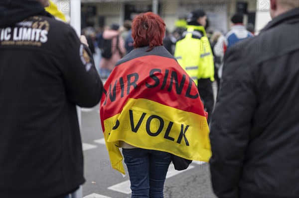 A woman wrapped in a German flag with the inscription 'AeoeWe are the people'Aeo, taken during the 'AeoeFarmers' protests'Aeo in Berlin, 22/03/2024