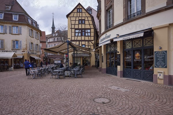 Old town with cobblestones, half-timbered houses, retail shops and restaurants in Colmar, Department Haut-Rhin, Grand Est, France, Europe