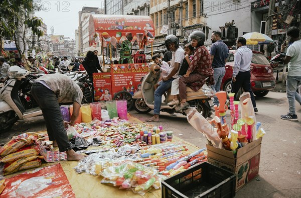 Vendor sells Holi celebration items in a street market, ahead of Holi festival on March 23, 2024 in Guwahati, Assam, India. Holi is the Hindu festival of colours, it is celebrated with great joy in India