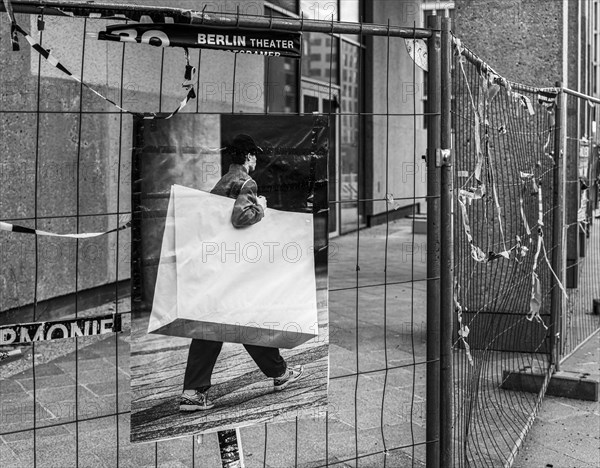 Black and white photograph, symbolic photo, poster on a construction fence, Berlin, Germany, Europe