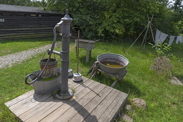 Laundry area with water pump in the garden from the 19th century, Open-Air Museum of Folklore Schwerin-Muess, Mecklenburg-Vorpommerm, Germany, Europe