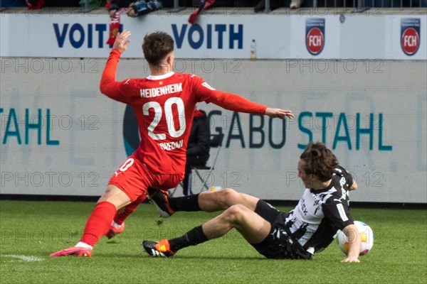 Football match, Nikola DOVEDAN 1.FC Heidenheim in a duel for the ball with Florian NEUHAUS Borussia Moenchengladbach, Voith-Arena football stadium, Heidenheim