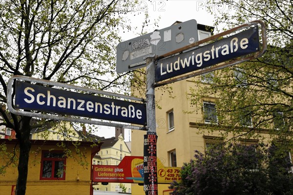 Traffic sign at an intersection with the name of two streets in front of a yellow building, Hamburg, Hanseatic City of Hamburg, Germany, Europe