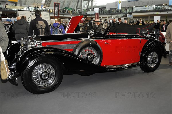 RETRO CLASSICS 2010, Stuttgart Trade Fair, Red Mercedes-Benz classic car convertible on a presentation with wire wheels, Stuttgart Trade Fair, Stuttgart, Baden-Wuerttemberg, Germany, Europe