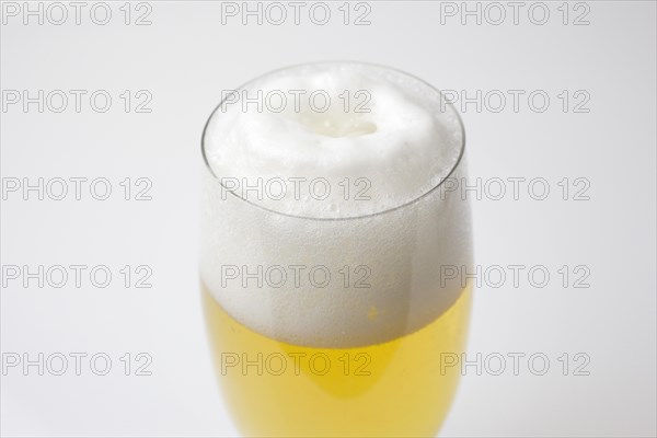 Freshly tapped beer with a head of foam in the beer glass, 07.12.2016