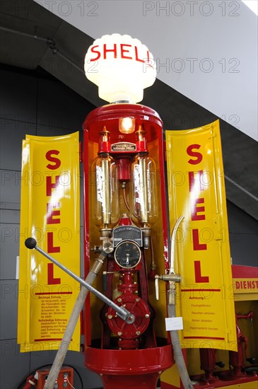 RETRO CLASSICS 2010, Stuttgart Messe, Old red and yellow Shell petrol pump with vintage charm in an exhibition room, Stuttgart Messe, Stuttgart, Baden-Wuerttemberg, Germany, Europe