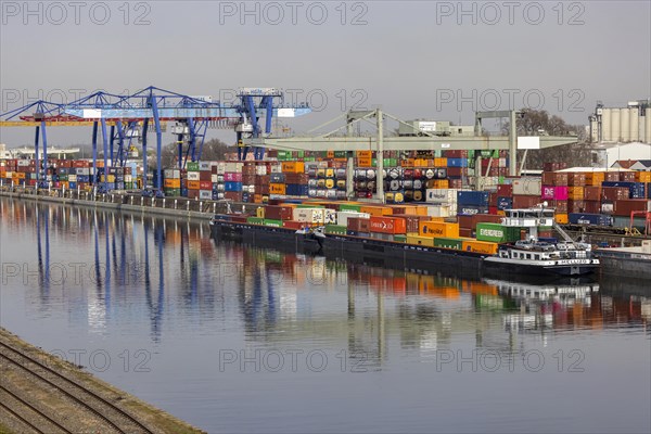Container terminal in the port of Mannheim, sea containers are stacked in one of the most important inland ports in Europe, trimodal transport node, infrastructure for the exchange of goods, Mannheim, Baden-Wuerttemberg, Germany, Europe