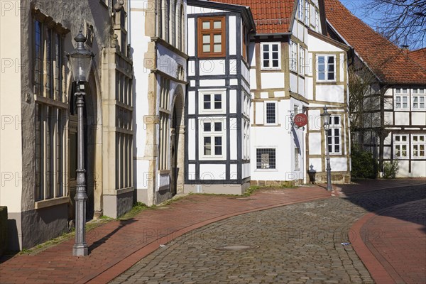 Historic facades and half-timbered houses, lantern and cobblestone street in the Schnurrviertel in the old town centre of Minden, Muehlenkreis Minden-Luebbecke, North Rhine-Westphalia, Germany, Europe