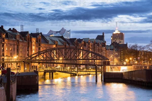 Speicherstadt Hamburg and Elbe Philharmonic Hall with customs canal at the blue hour, Hamburg, Germany, Europe