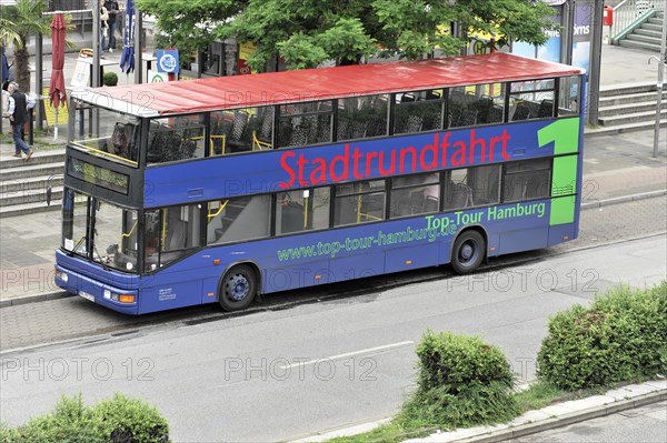 A blue sightseeing double-decker bus at a city bus stop, Hamburg, Hanseatic City of Hamburg, Germany, Europe