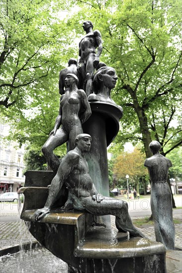 Fountain with sculptures of female figures surrounded by urban greenery, Hamburg, Hanseatic City of Hamburg, Germany, Europe