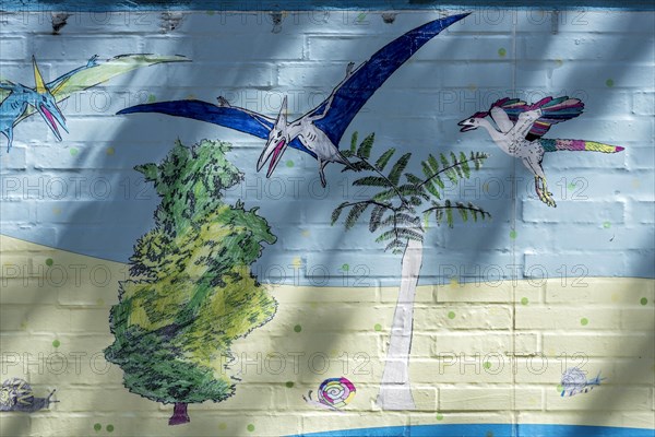 Animals of prehistoric times on land and in the air, snails, pterosaurs, colourful illustration, children's drawing on the wall of the Hermann Hoffmann Academy, Justus Liebig University JLU, Altstadt, Giessen, Giessen, Hesse, Germany, Europe