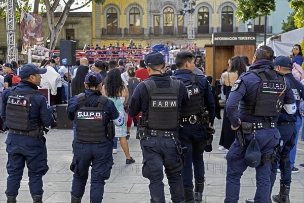 Oaxaca, Mexico, Police officers keep watch outside a youth boxing match in the zocalo, Central America