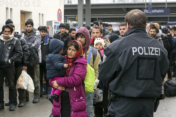 Refugees arriving at Rosenheim station, being taken to registration by federal police officers, 05/02/2016