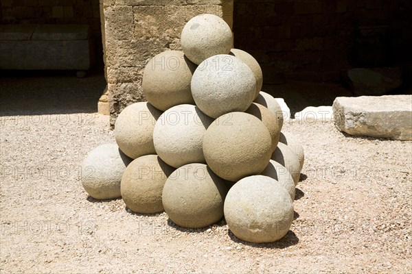 Stone sling shot balls, Archaeological museum, Rhodes, Greece, Europe